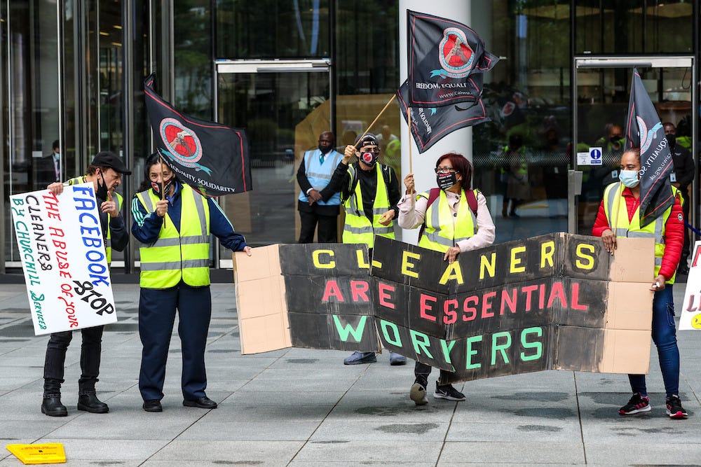 Cleaners protesting outside Facebook's HQ at Ten Brock Street in central London in August.