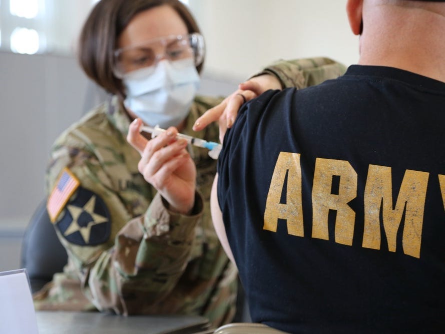 US Army nurse administers COVID-19 vaccine at Fort Meade in Maryland.