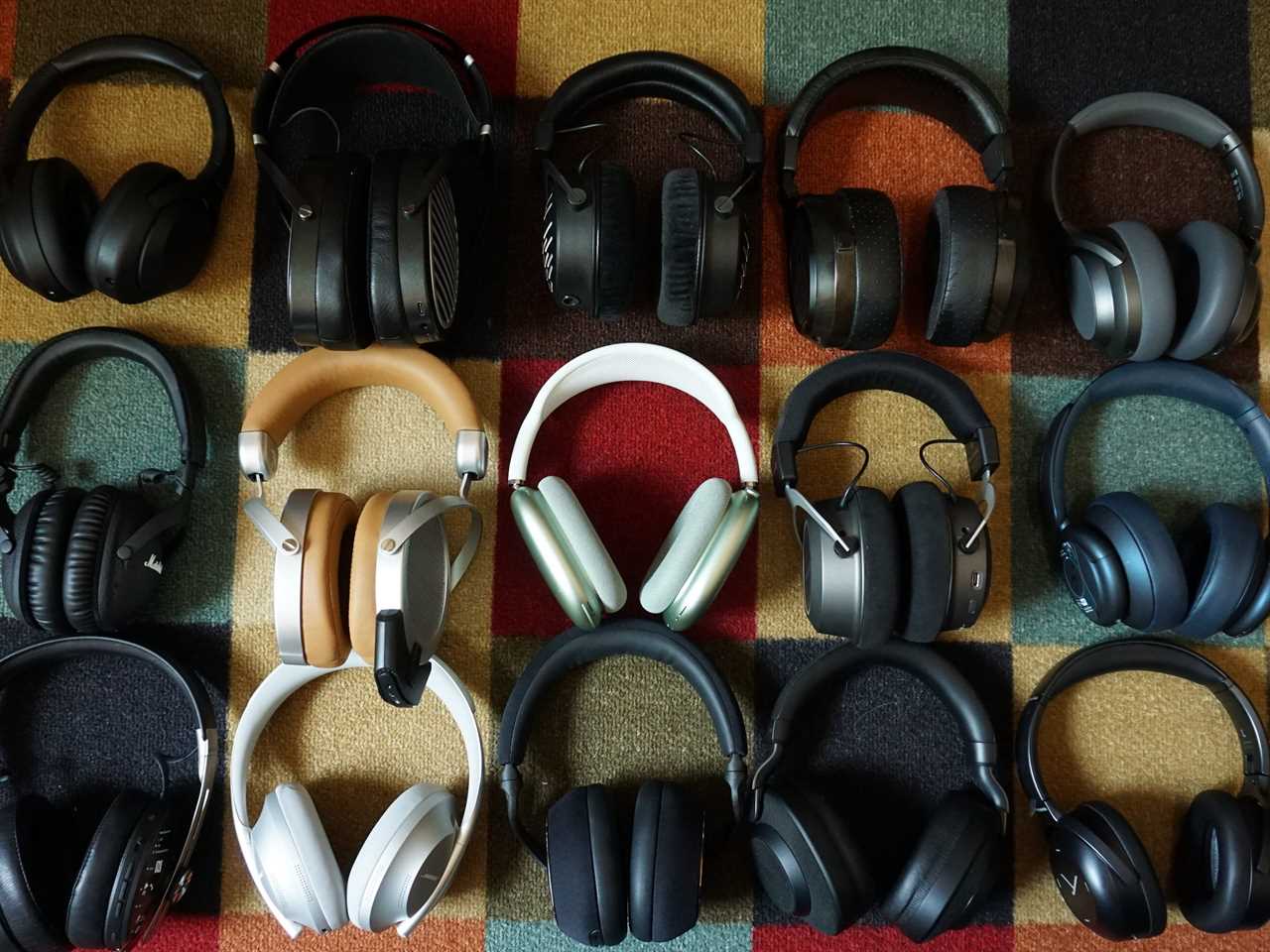 All of the headphones we tested on a patterned carpet - best over-ear headphones