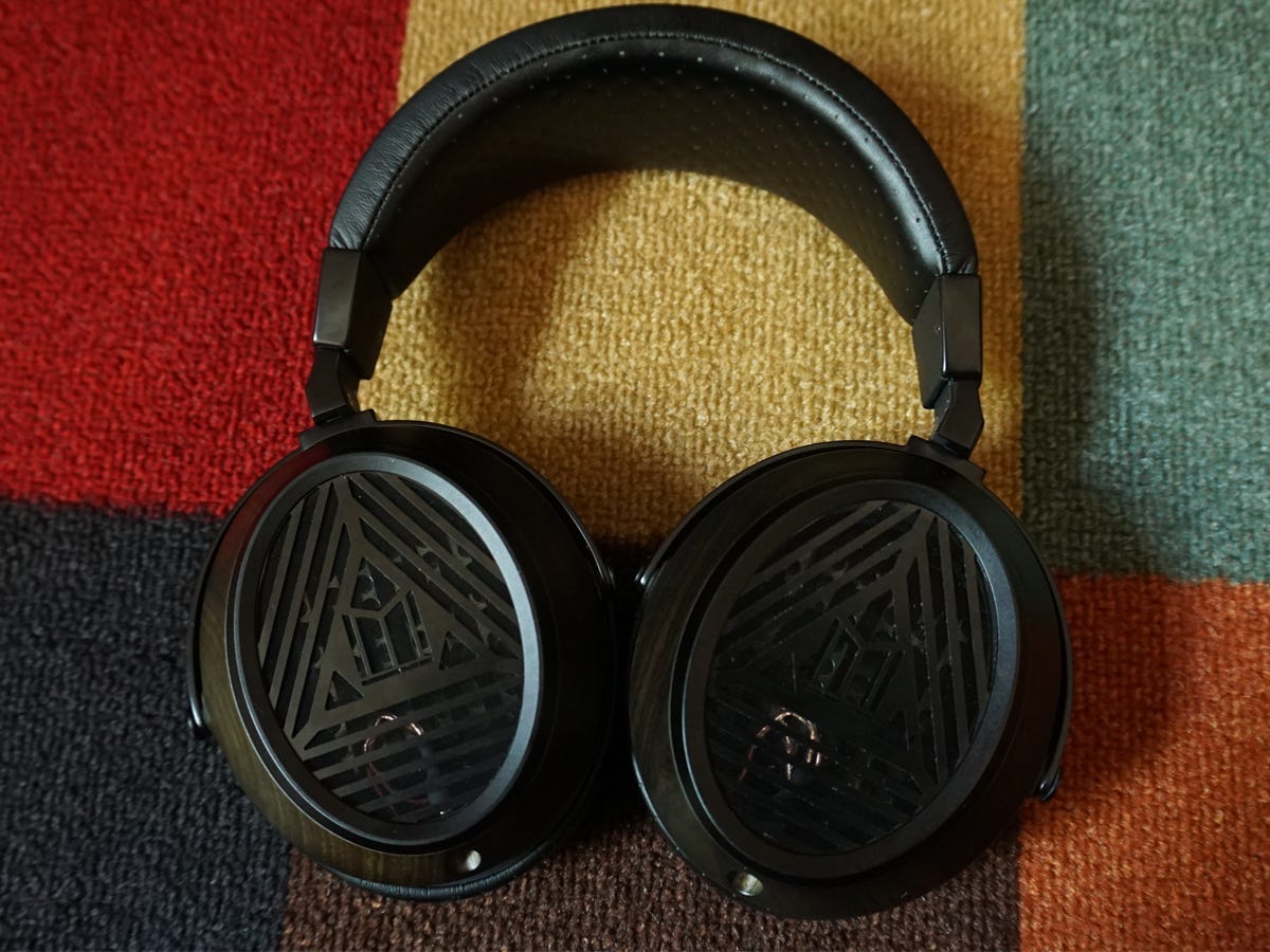 The Monoprice Monolith M570 sitting on a patterned carpet - best over-ear headphones overall