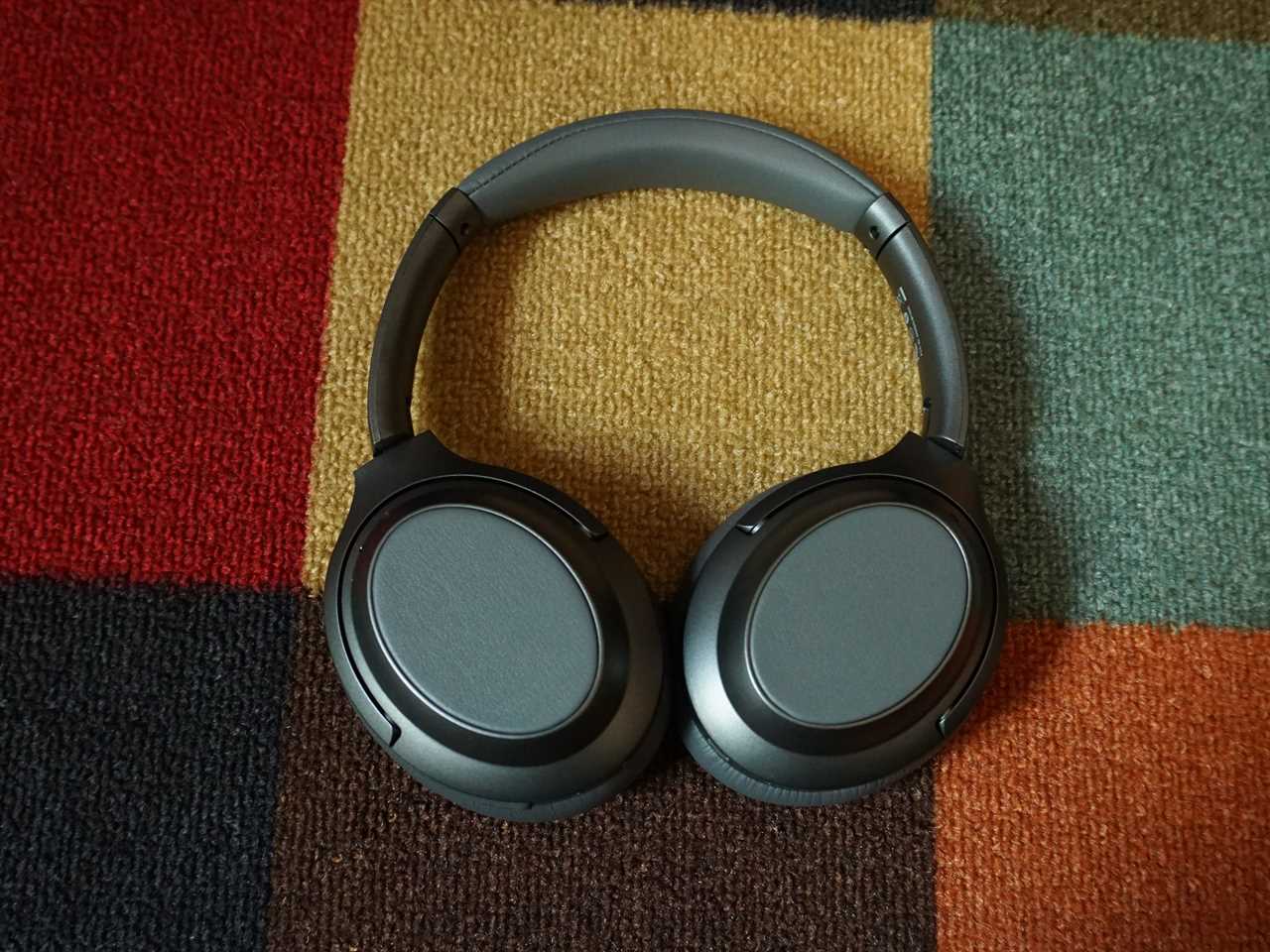 The Monoprice BT600ANC headphones on a patterned carpet - best budget over-ear headphones