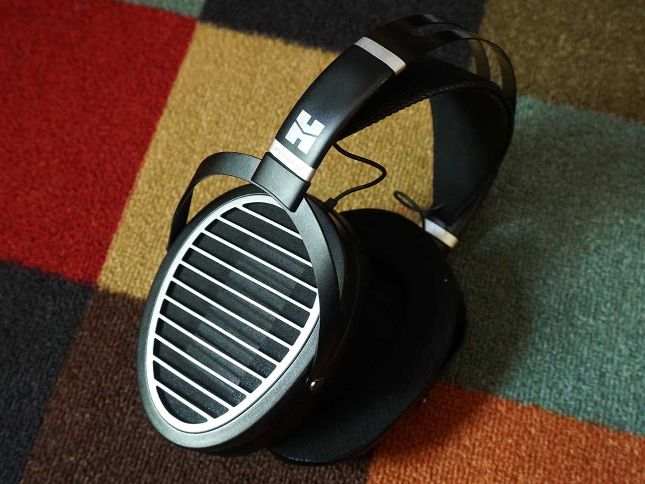 The Hifiman Ananda BT headphones on a patterned carpet - best premium wireless over-ear headphones