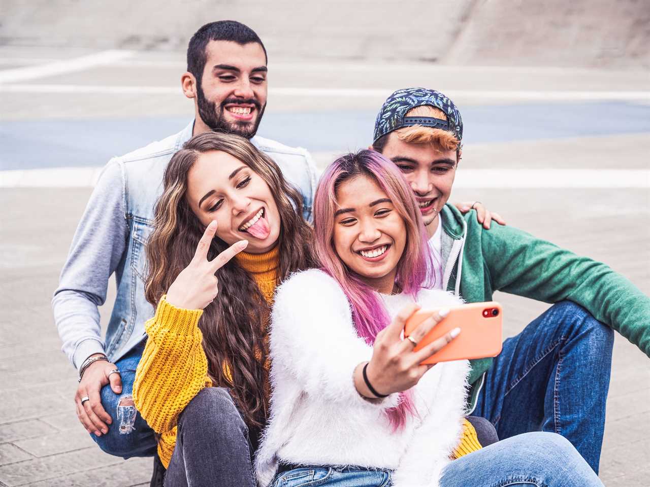 Gen Z hangs out in a group setting and takes a selfie