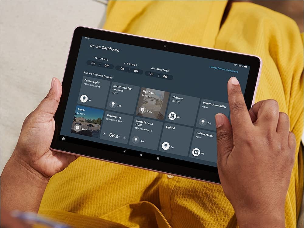 A woman using the Amazon Fire HD 10 tablet