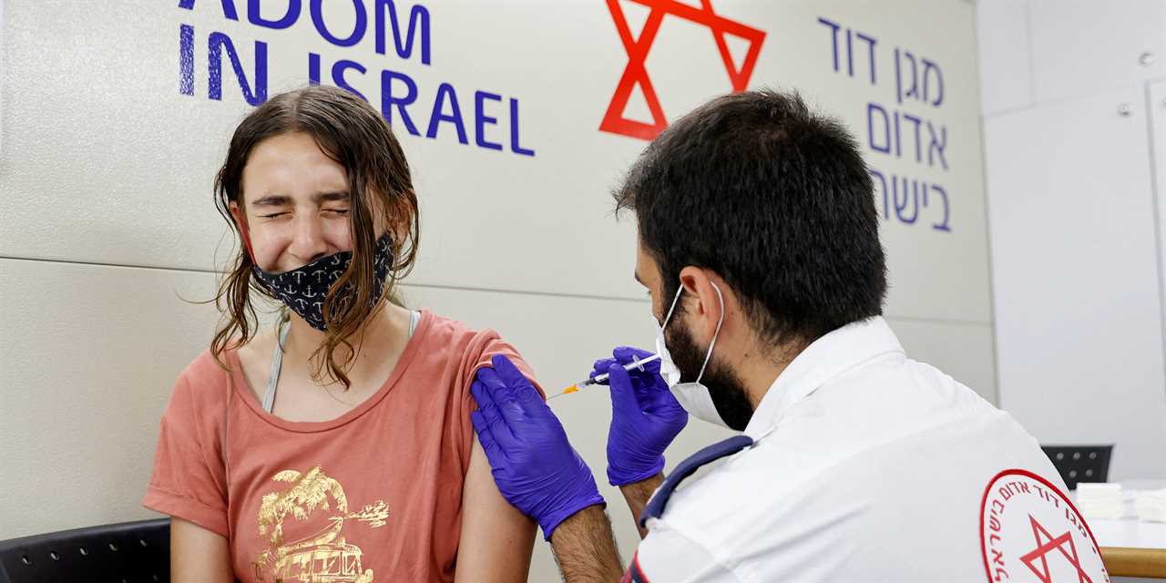 Teenager in Israel receiving vaccine injection