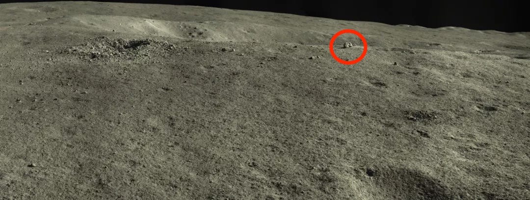 moon surface with rabbit-shaped rock in the distance